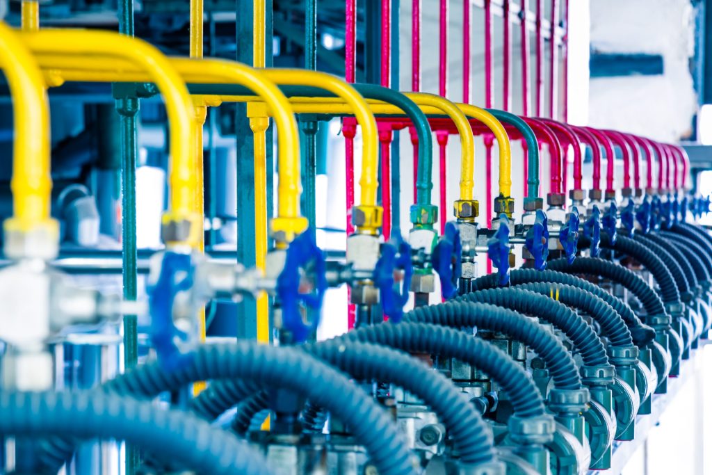 steel pipelines and cables in a plant,Industrial zone.